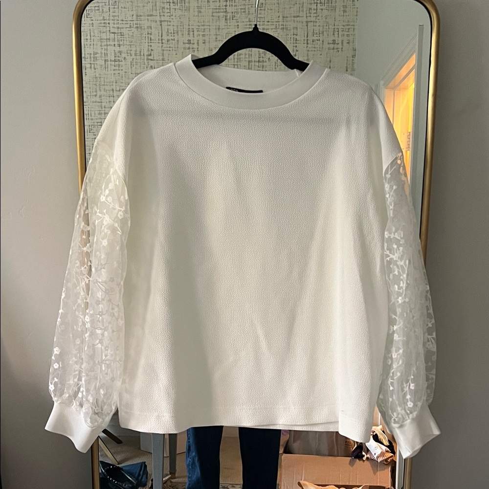 Elegant White Top with Sheer Sleeves